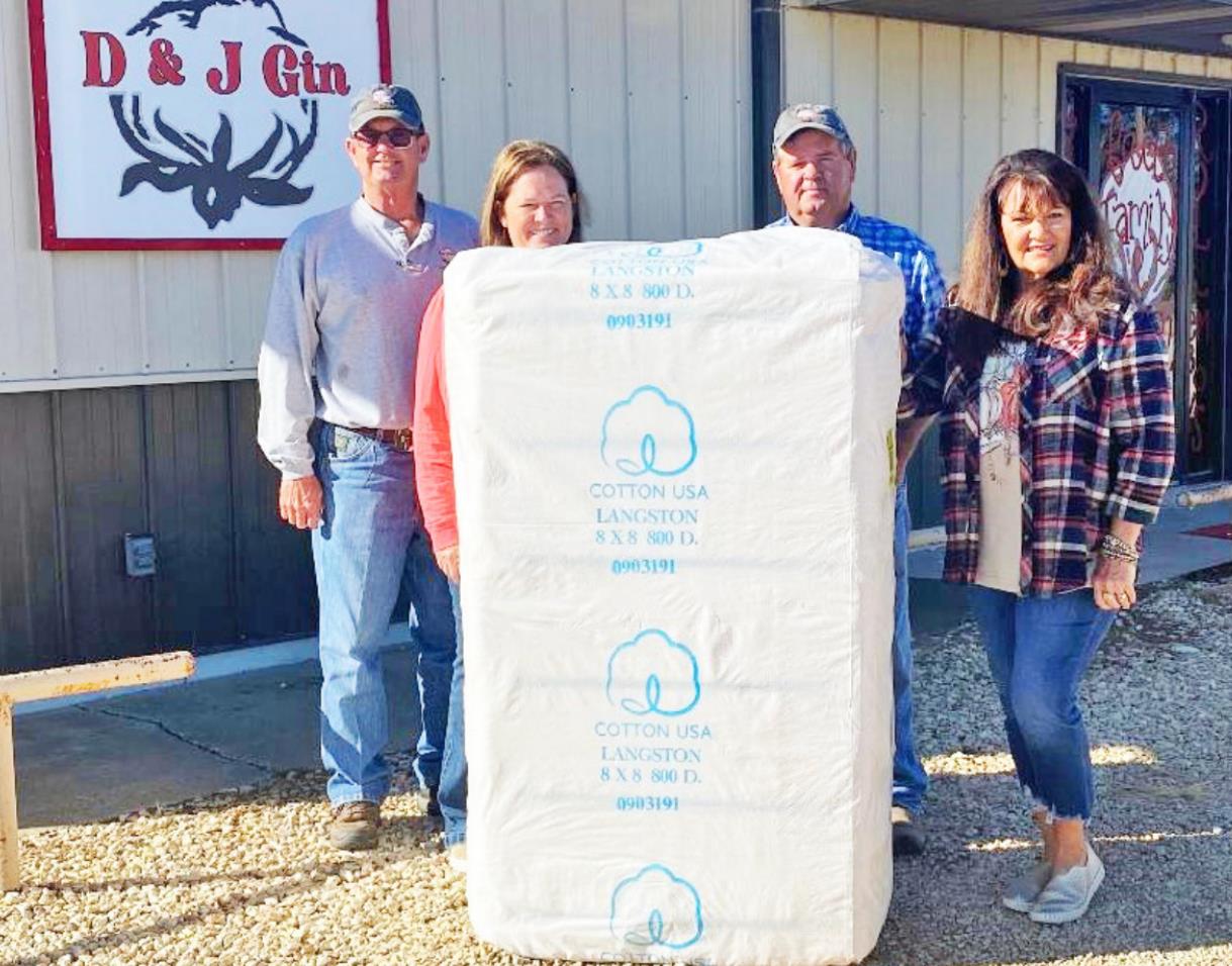 FIRST BALE OF COTTON ginned in Floyd County was from producer Jimmy Collins. D &amp; J Gin in Lockney ginned it Thursday, Oct. 9. From left: David Foster, Shawnda Foster, Jimmy Collins and Lesca Durham.
