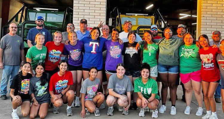 TEAM WORK ON AND OFF THE FIELD The Lady Winds softball team had some bonding time with the Floydada Volunteer Fire Department on Monday, Oct. 27. The guys showed them the ins and outs of working the hoses and working as a team. The youngsters had an awesome time and enjoyed being alongside their hometown heroes. | COURTESY PHOTOS