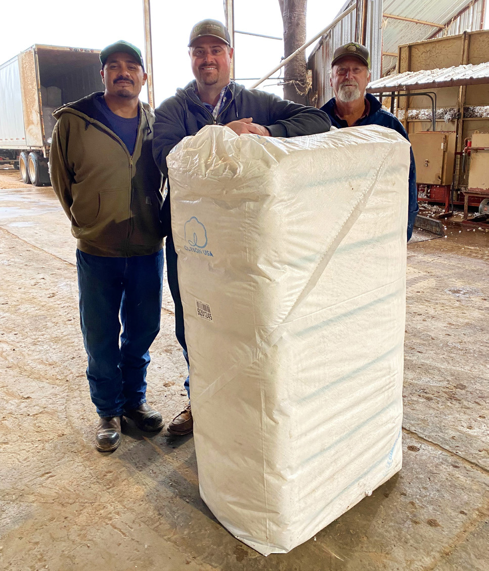 FIRST BALE OF COTTON ginned in Floyd County and Floydada in 2026 was from producer Jacob Reddy. McCoy Gin ginned the bale on Wednesday, Oct. 7. From left are ginner Raul Corado, producer Jacob Reddy and gin manager Andy Rainwater. | COURTESY PHOTO