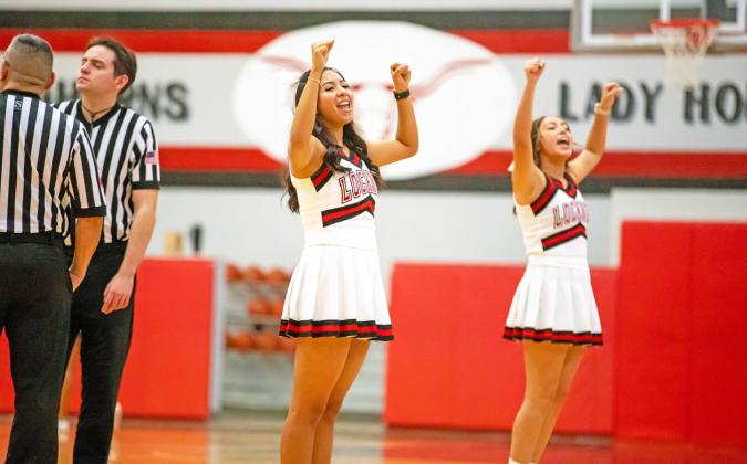 CHEERING THE LONGHORNS during last week’s basketball action are Victoria Salazar and Caelyn Jimenez. MORE PHOTOS, PAGE 5 | CERVANTES PHOTOGRAPHY