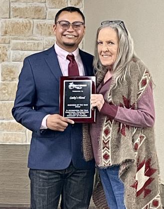 CATHY'S FLORAL Cathy Graham (right) was honored as the Floydada Chamber's Business of the Year. She has been providing floral arrangements and gifts for more than 20 Years. Chamber manager Isaac Martinez presented the plaque. | HESPERIANBEACON