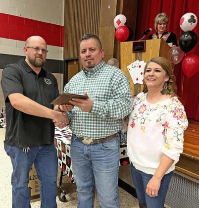 BUSINESS OFTHEYEAR The Old Maroon Saloon (Danny Huggins, owner) was selected as Business of the Year 2022. The plaque was presented by Jose and Melissa Martinez, representing the 2021 Business of the Year. | COURTESY PHOTO