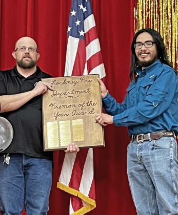 FIREMAN OFTHEYEAR The Lockney Chamber recognized Danny Huggins as Fireman of theYear for 2022.The plaque was presented by Fireman of theYear 2021 Jonathan Sustaita. | COURTESY PHOTO