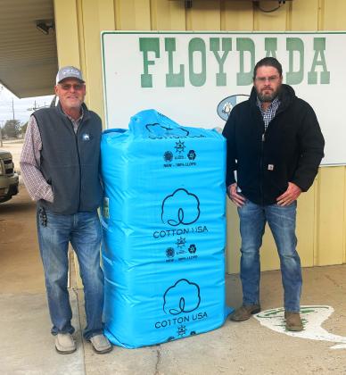 FIRST BALE OF COTTON ginned in Floydada and Floyd County from the 2025 harvest was from producers Steve Lloyd and Shane Lloyd. Floydada Coop Gin ginned it Tuesday, Oct. 7, 2025. Above left: Aaron Hendricks, Floydada Coop Gin Manager; right, producer Shane Lloyd. Not pictured is Steve Lloyd. | HESPERIAN-BEACON