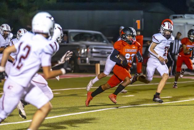 BREAKTHROUGH In last week’s victory over Clarendon, the game’s signature play came in the second half when freshman Kason Villarreal broke free for a 98-yard touchdown sprint. MORE PHOTOS, PAGE 5 | CERVANTES PHOTOGRAPHY