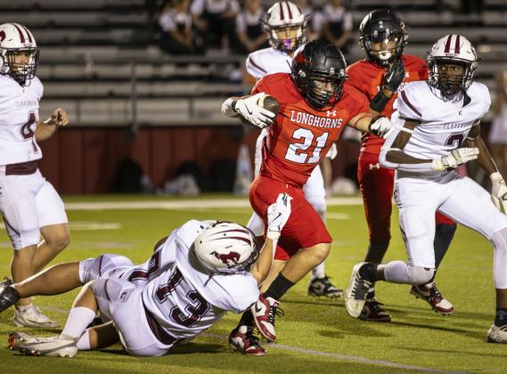 De Los Santos running through defenders