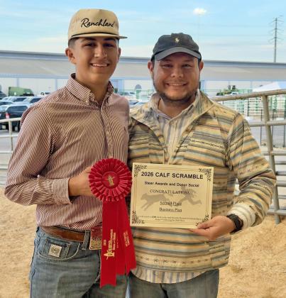 HOUSTON HONORS Nick Cervantes wrapped up his Houston Livestock Show and Rodeo show tour with his calf scramble steer, Rusty. Nick, shown here with Adrian Jimenez, earned 2nd place for his business plan with the Calf Scramble Committee. | CERVANTES PHOTOGRAPHY