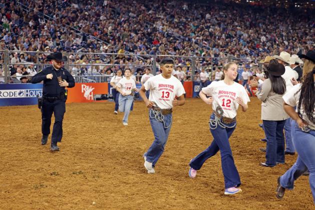 Nick Cervantes pursues his animal at Houston Calf Scramble