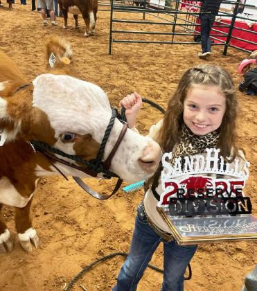 CONGRATULATIONS go to Paislee Nutt of Floydada for being awarded the Reserve Division Champion with her horned Hereford at the 2025 Sandhills Stock Show &amp; Rodeo last Saturday at the Ector Coliseum in Odessa. She showed through the Floyd County 4-H. Paislee is the daughter of Jason and Whitley Nutt. | COURTESY PHOTO
