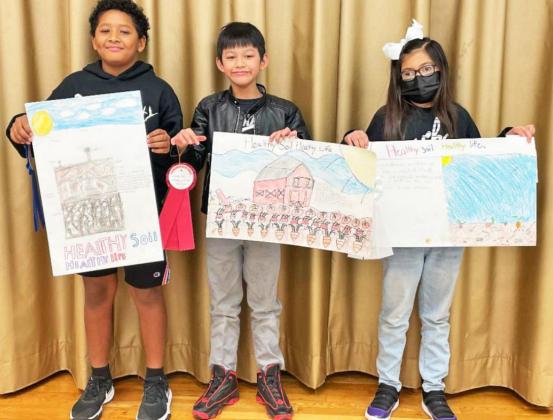 Above, from left, fourth grade winners were Derrick Henderson, first place; Lee Henry Mao, second place; and Paulina Ramirez, third place.