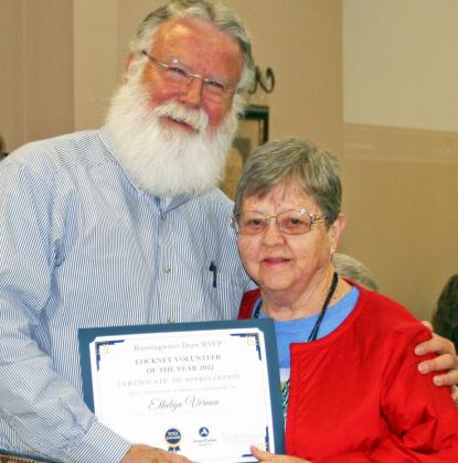RSVP HONORS – Rodney Watson, advisory board member, hands Ethelyn Vernon her certificate as she was recognized for her service last week to the Retired and Senior Volunteer Program.