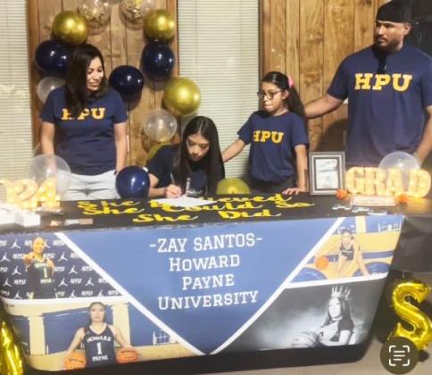 LETTER OF INTENT The Lady Winds’Zay Santos signed her letter of intent with Howard Payne University to play at the next level with the Lady Jackets basketball program. From left: Cynthia Santos, Azaylee (Zay) Santos, Aliana Santos and Jerry Santos. | COURTESY PHOTO
