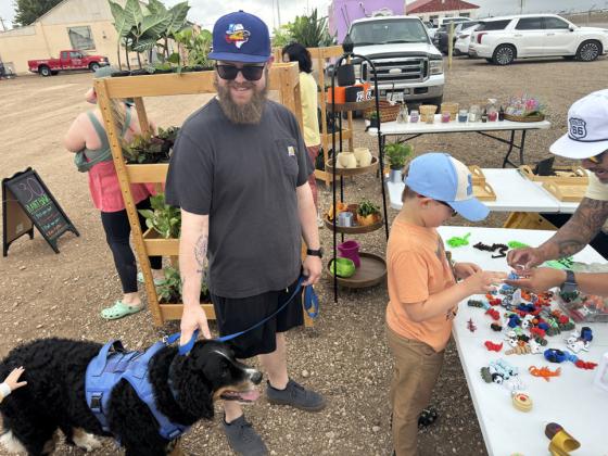 POODLE AND POOCH An Amarillo Sod Poodles baseball fan brought his four-legged friend along to the Helium Heights Market June 6. | TEXAS SPUR