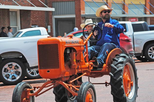 MAY OLD SETTLERS PARADE might have been a bit damp—but there was plenty of enthusiasm for old tractors, vintage cars, delicious treats, and fun and games on the Floyd County courthouse square as residents and visitors alike celebrated their local heritage.