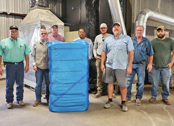 FIRST BALE OF COTTON ginned in Floyd County and Floydada for the 2024 season was from producer/owner Ian McIntosh. Darty Gin of Dougherty ginned the bale at 12:21 p.m., Monday, Sept. 30. Front row from left, gin owners Marty Covington, Jim Covington and Ian McIntosh; back row from left, gin owners Wesley Campbell, David Martinez and Brayden Campbell, gin manager Les Gary, and ginner Daniel Ortega. Not pictured gin owners Colton Covington, Jason Campbell and Logan Bradley and ginner Aj Garcia. | PHOTO BY SAN