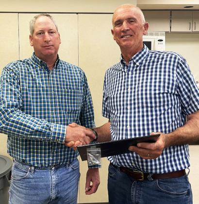 LIGHTHOUSE CREDENTIALS Mark Hegi, board president (right), recently presented Wesley Campbell of Matador, director, with his Credentialed Cooperative Director certificate. Campbell completed courses that will prepare him to fulfill his fiduciary duty to the members of Lighthouse Electric Cooperative, which serves 12 Texas counties, including Hale, Floyd, Swisher, Briscoe, Hall, Crosby, Dickens, Motley, Donley, Childress, Collingsworth, and Cottle. | COURTESY PHOTO