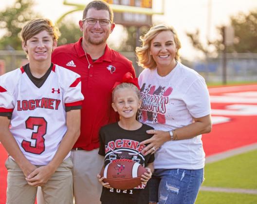 STEPPING UP Coach Jonathan Thiebaud and his wife, KayCee (right), have two children in Lockney ISD: Dyllan is a freshman at Lockney High School and Anna is in the fourth grade at Lockney Elementary. | CERVANTES PHOTOGRAPHY