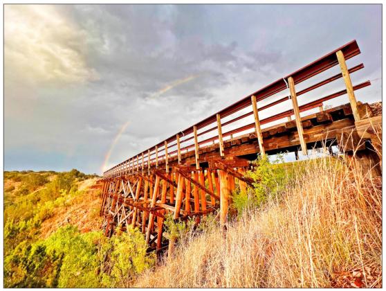 RAINBOW AT THE ROOST Earlier this month, a guided tour to view the bat emergence at the Clarity Tunnel yielded an added bonus, a rainbow above one of the route’s historic railroad bridges. The full rails-to-trails route begins in South Plains, in Floyd County, and goes to Estelline, in Hall County. | PHOTOS COURTESY OF SAINTS ROOST EXPEDITION