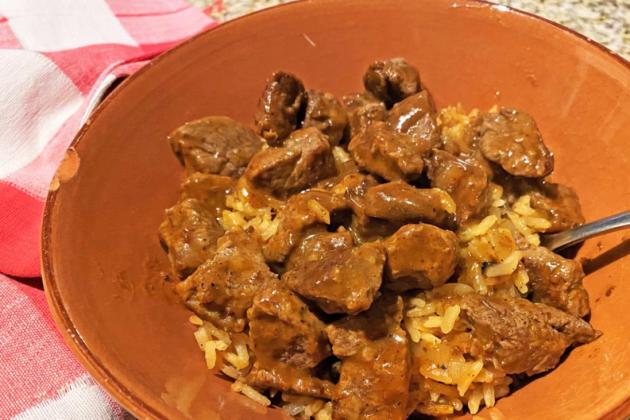 FAMILY STYLE My husband’s mother often braised cubes of beef or pork in a sauce made of freshly ground, dried chile pods. He loved it over potatoes; this version uses rice. | ANGELINA LaRUE