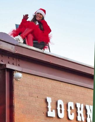 ELF ONTHE … ROOF? The Lockney Elementary office elves, Chip and Snowflake, decided to kick off the day with a little mischief—they put the principal on the roof to welcome our students. Those silly elves and their shenanigans! See if you can spot another one elsewhere elsewhere in this issue! | LOCKNEY ISD PHOTOS
