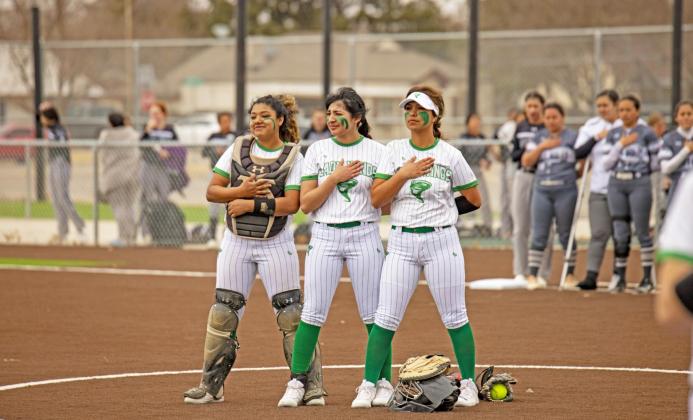 PREPARING TO PLAY in high winds on the brand-new Lady Winds Field in Floydada Feb. 21were catcher Marissa Obregon, Analise Pérez and starting pitcher Erin Trevino under the coaching of Armado Morales. | CERVANTES PHOTOGRAPHY