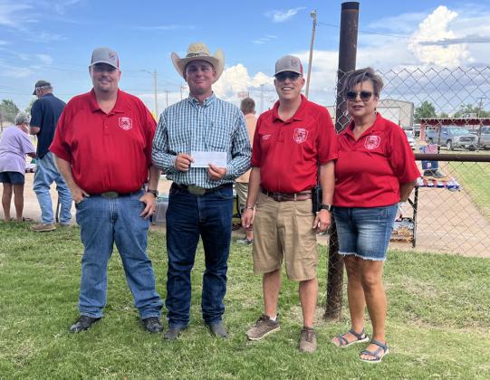 IN APPRECIATION Floyd-Briscoe County Farm Bureau presented the Silverton Volunteer Fire Department with a $5,000 donation. Giving and receiving the donation are, from left, Kody Rhoderick, VFD assistant chief; Farm Bureau representative Chance Rhoderick; JoDee Robinson, VFD chief; and Norma Trevino, fire department secretary. | COURTESY PHOTO