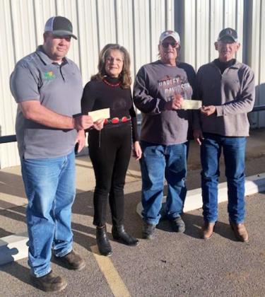 DANCIN’ FOR DOLLARS Floydada Fire Chief Chad Guthrie and Lockney Fire Chief Donny McGlaughlin accept checks from Wendell and Dustee Sollis. Each department was given $10,000.00 from the proceeds of the Eighth Annual Country Christmas Ball. | COURTESY PHOTO
