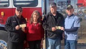 THE 2023 COUNTRY CHRISTMAS BALL raised $24,000 for the Floyd County Firefighters. Wendell and Dustee Sollis presented checks to the Lockney Volunteer Fire Department and Floydada Fire Department fire chiefs. Shown, from left, are Donny McGlaughlin, Lockney Fire Chief; Dustee Sollis; Chad Guthrie, Floydada Fire Chief; and Wendell Sollis, leader of the Sidekicks All Star Band. | COURTESY PHOTO