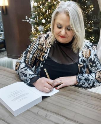AMY BEARDEN of Roaring Springs signed copies of her devotional book “Worship in the Waiting” in December, when it was first published. She will sign books in her hometown Saturday, April 20 at The Coffee Depot from 11 a.m. to 1 p.m. | COURTESY PHOTO