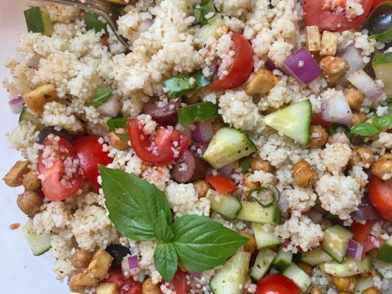 COOKED GRAINS with roasted chickpeas and tofu, mixed with fresh herbs, tomatoes, cucumbers, red onion, and tangy olives combine to give us the tastiest serving of veggies and protein I’ve had all season. | ANGELINA LaRUE PHOTO