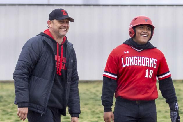 Coach Farmer and Xavier Jimenez.