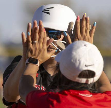 Brinley Lefevre and Coach Nuncio after a single.