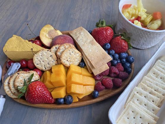 COOL ANDTASTY An assortment of fruits, crackers, and cheeses, artistically arranged. makes for a great “cold plate” on summer days. | ANGELINA LaRUE PHOTO