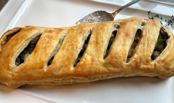 DECADENT BUT LIGHT While the pastry crust for this dish is decadent, filled with light ingredients like mushrooms, spinach, and caramelized onions, it doesn’t make me fill stuffed. | ANGELINA LaRUE PHOTO