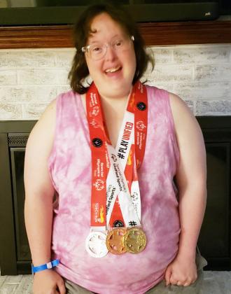 Kami Holbert received gold in the 4x100-meter relay, silver in the 100-meter sprint, and bronze in the softball throw.