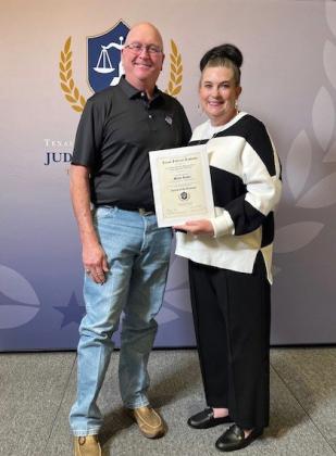 FLOYD COUNTY JUDGE MARTY LUCKE (left) was recognized as a Fellow of the Texas Judicial Academy by Texas Association of Counties (TAC). The Honorable Stephanie L. Davis, Comanche County Judge and Chair of the County Judges Education Advisory Committee, hands Lucke his certificate. | COURTESY PHOTO