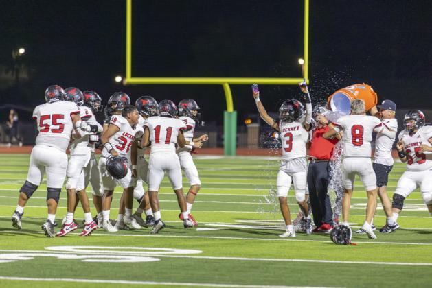 THE CHILL OFVICTORY Coach Thiebaud and his players celebrate in cool style following their Friday night win over Floydada. | CERVANTES PHOTOGRAPHY