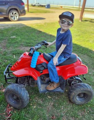 RIDE ON Hunter Wells of Floydada enjoyed his own wheeled toys. | COURTESY PHOTO