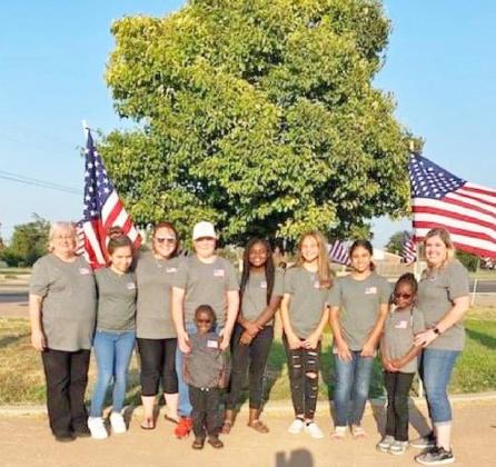 ”Y’ WE ALWAYS REMEMBER Members of the Floydada Girl Scout Troop 6210 put flags out on the “Y” highway entry in Floydada in in memory of Sept. 11, 2001. | COURTESY PHOTOS