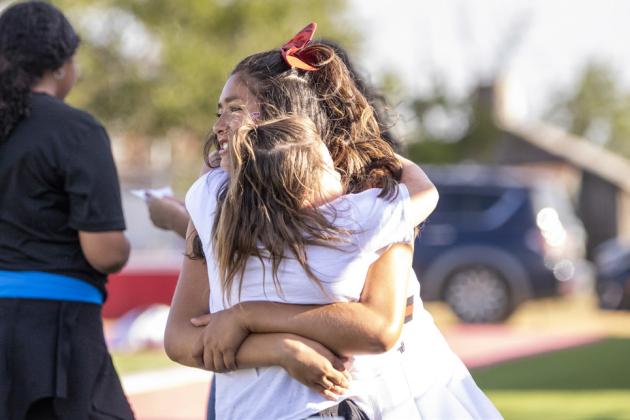 Lily Jimenez Varsity Cheer with one of her little cheerleaders