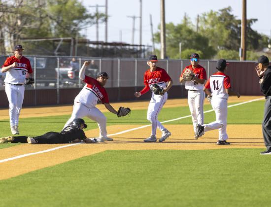 Longhorns caught the Indians in pickle out at third.