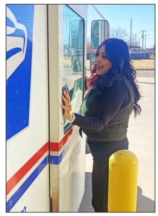 One duty of new Floydada postmaster Esmeralda Aguirre is checking every postal vehicle at the beginning of each route. | HESPERIAN-BEACON PHOTOS