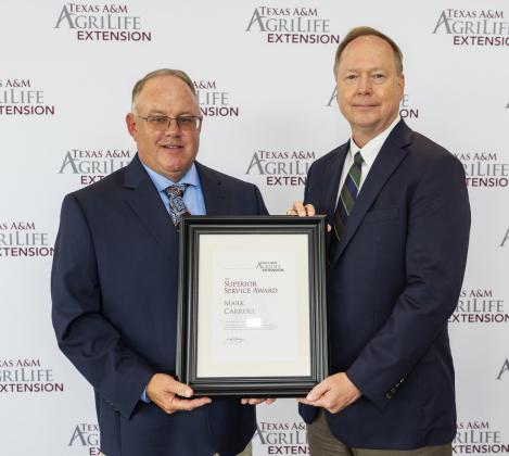 MARK CARROLL (left) recently received County Extension Superior Service Award from Dr. Rick Avery, director of Texas A&amp;amp;M AgriLife Extension Service. | COURTESY PHOTO
