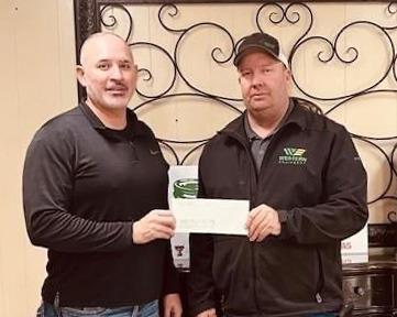 Floydada Collegiate ISD held a fundraiser for the Floydada Volunteer Fire Department on Friday, Jan. 12. All money collected at the gate during the basketball games versus Olton was donated to the fire department. FCISD superintendent Dr. Gilbert Trevino (left) presented Chief Chad Guthrie of the Floydada VFD with a check in the amount of $1573.25. | FLOYDADA CISD PHOTO