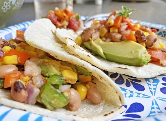 FLAVORFUL AND FLEXIBLE These jewel-toned tacos can be served meatless or with shredded chicken—and the topping goes well with rice or tortillas, too. | ANGELINA LaRUE PHOTOS