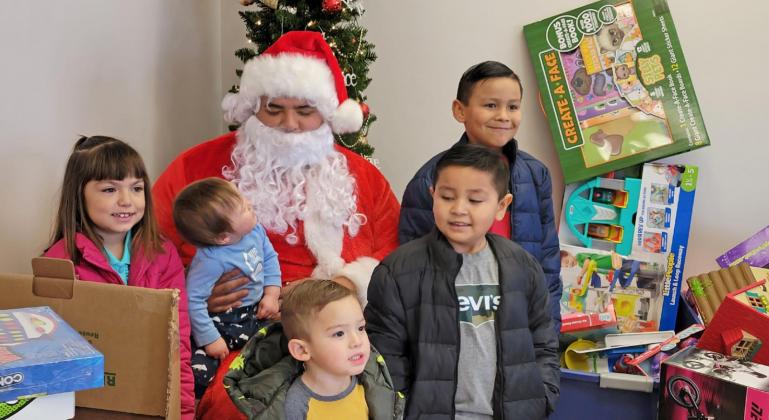 SPIRIT OF GIVING The Lockney Salvation Army distributed baskets to senior citizens on Friday, Dec. 17 and to families on Saturday, Dec. 18 along with Santa giving toys to children. . | COURTESY PHOTO