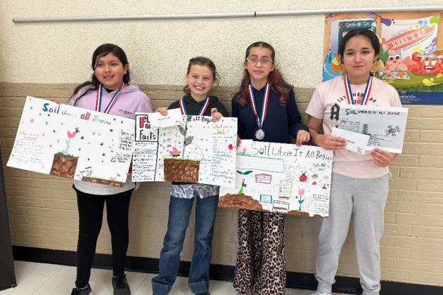 FIFTH GRADE poster winners were, from left, Alexi Cervera, 3rd place; Penelope Hernandez and Paislee Nutt, 2nd place (tie); and Roxann Llama and Baylee Jones (not pictured), 1st place (tie). | COURTESY PHOTO