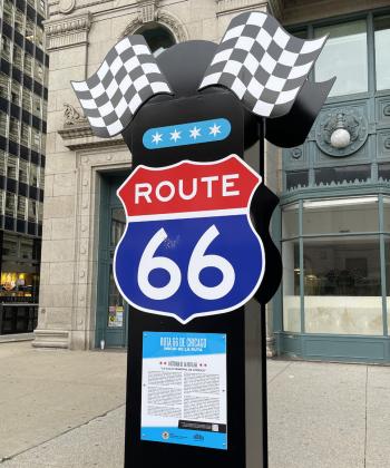 SIGN, SIGN This colorful new sign helps Route 66 travelers mark their starting line along busy Michigan Avenue across the street from the Art Institute of Chicago.