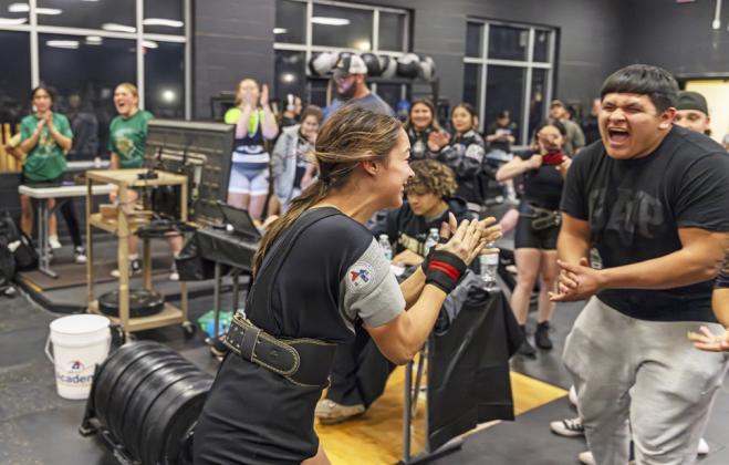 PULLING HER WEIGHT Sophie Gutierrez of the Lockney powerlifting squad celebrates a 1st-place finish in her weight class at the Westerner Invitational Feb. 13. | CERVANTES PHOTOGRAPHY