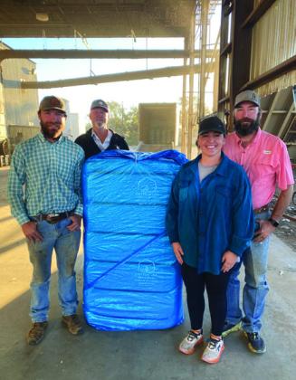 FIRST BALE OF COTTON ginned in Floyd County and Floydada this year was from producer Matthew Rainwater. McCoy Gin ginned the bale at 10:36 a.m., Saturday, Oct. 14. Shown are (back row, from left) gin manager Andy Rainwater and co-producer Matthew Rainwater; (front row, from left) harvester Logan Everett and co-producer Kember Rainwater. | COURTESY PHOTO
